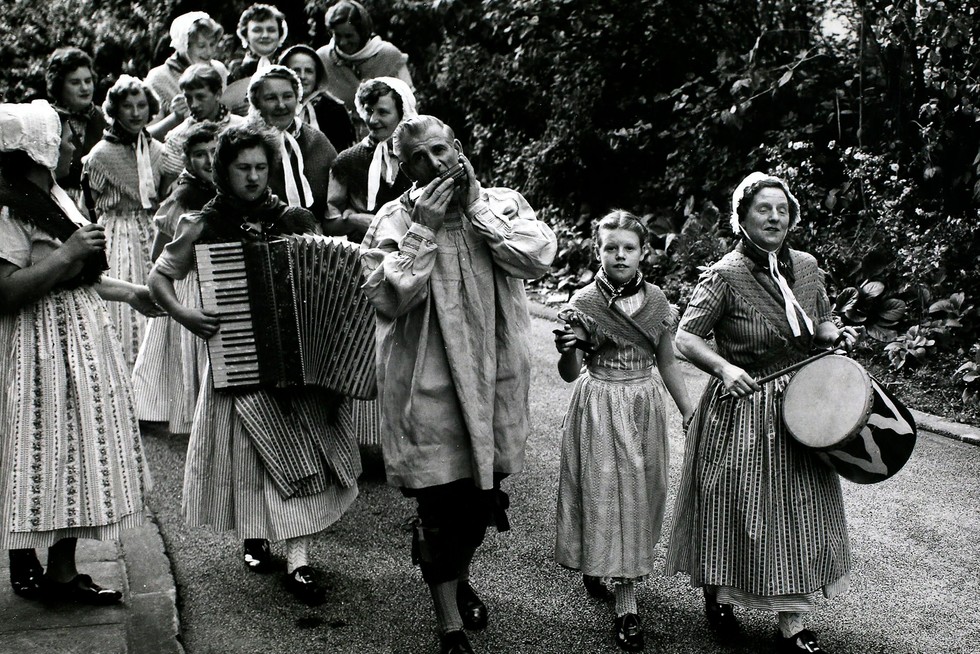 A choir and band from Wisbech arrive for the Diamond Jubilee festival of the English Folk Dance and Song Society at Cecil Sharp House, London in 1958